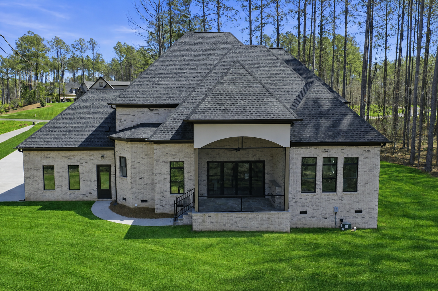 Screened Porch: Arched screened porch on brick estate