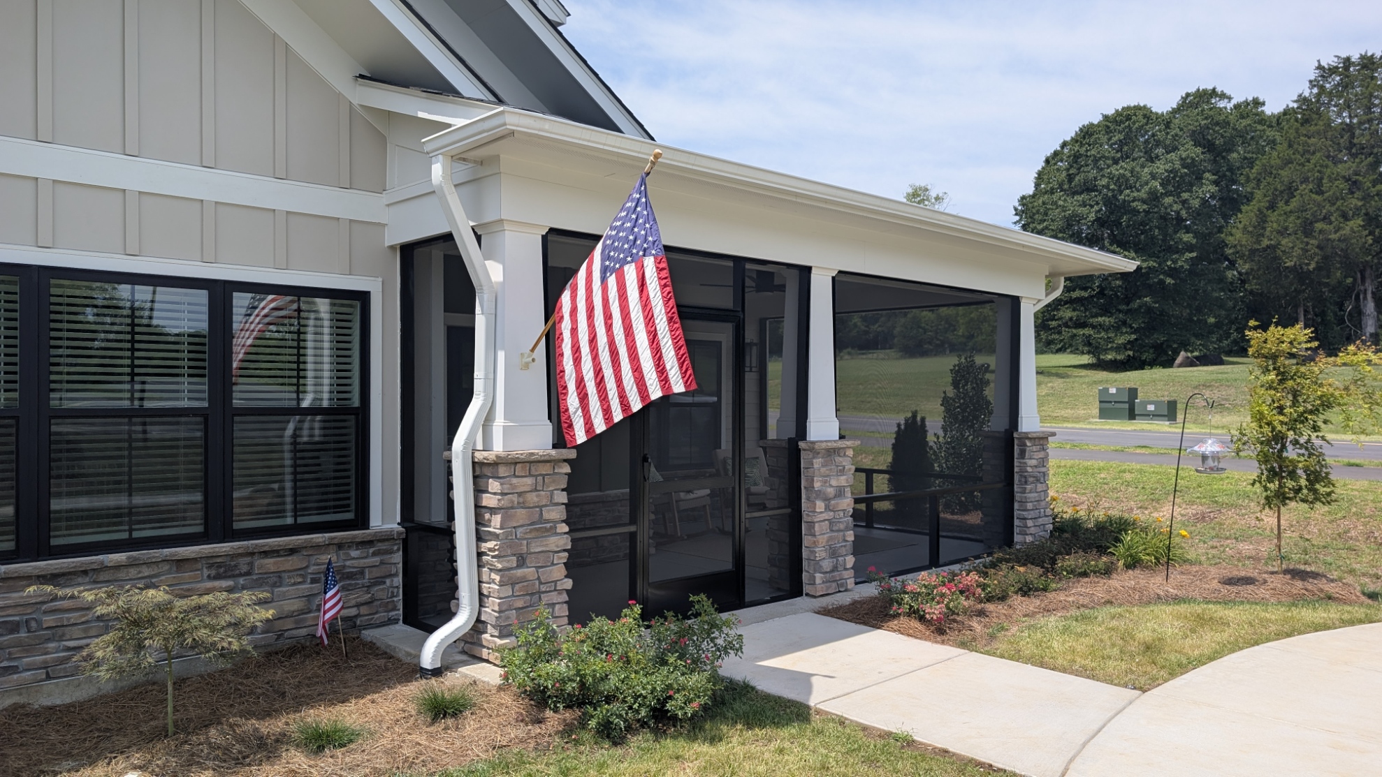 Screened Porch: Front porch enclosure with black framing