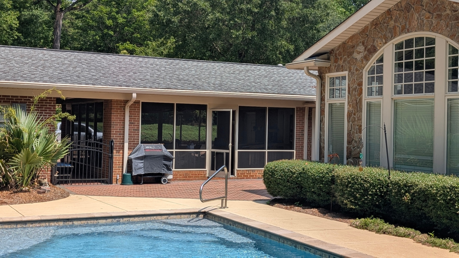 Screened Porch: Poolside screened enclosure on brick ranch