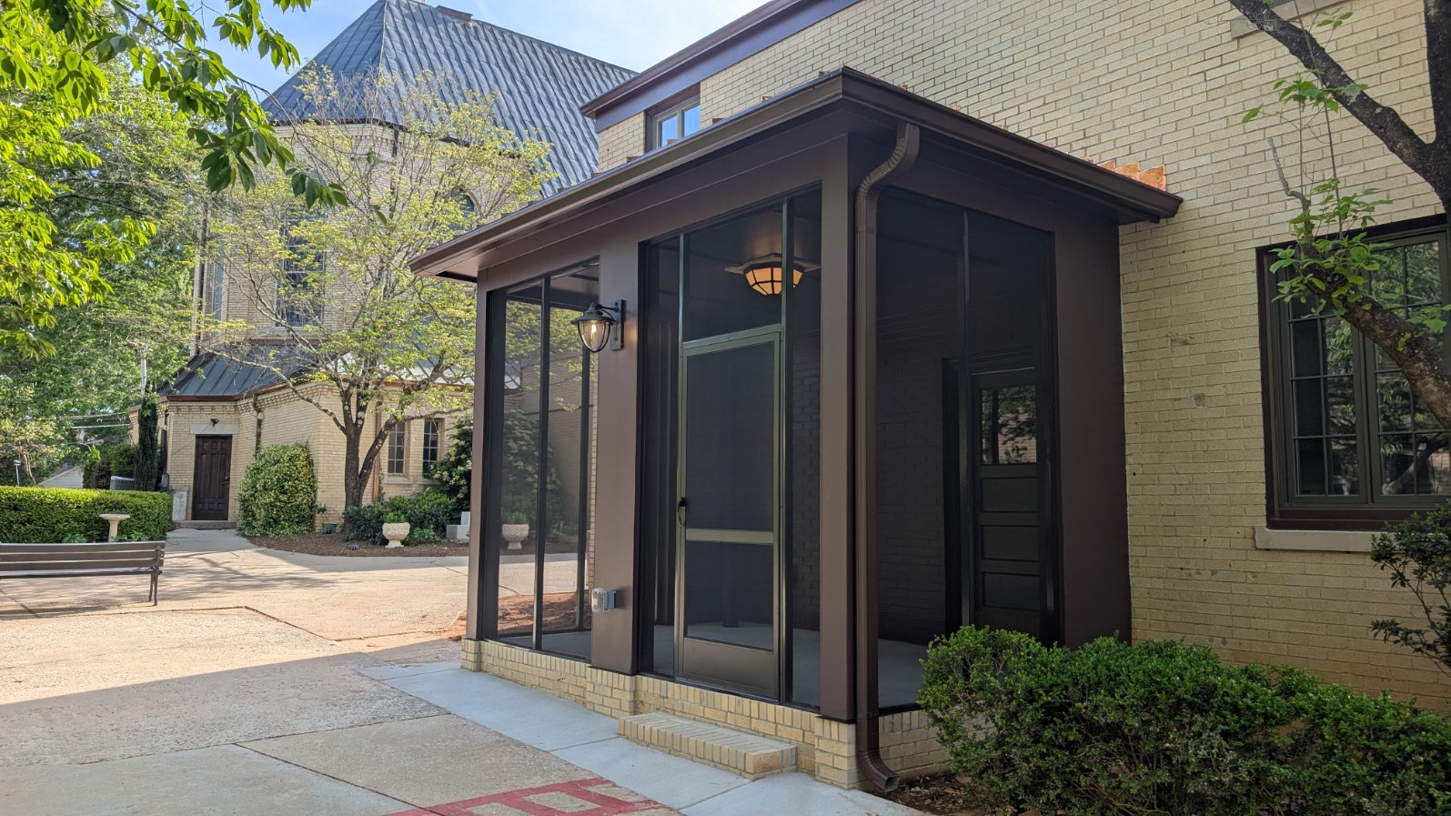 Screened Porch: Bronze-framed entry porch
