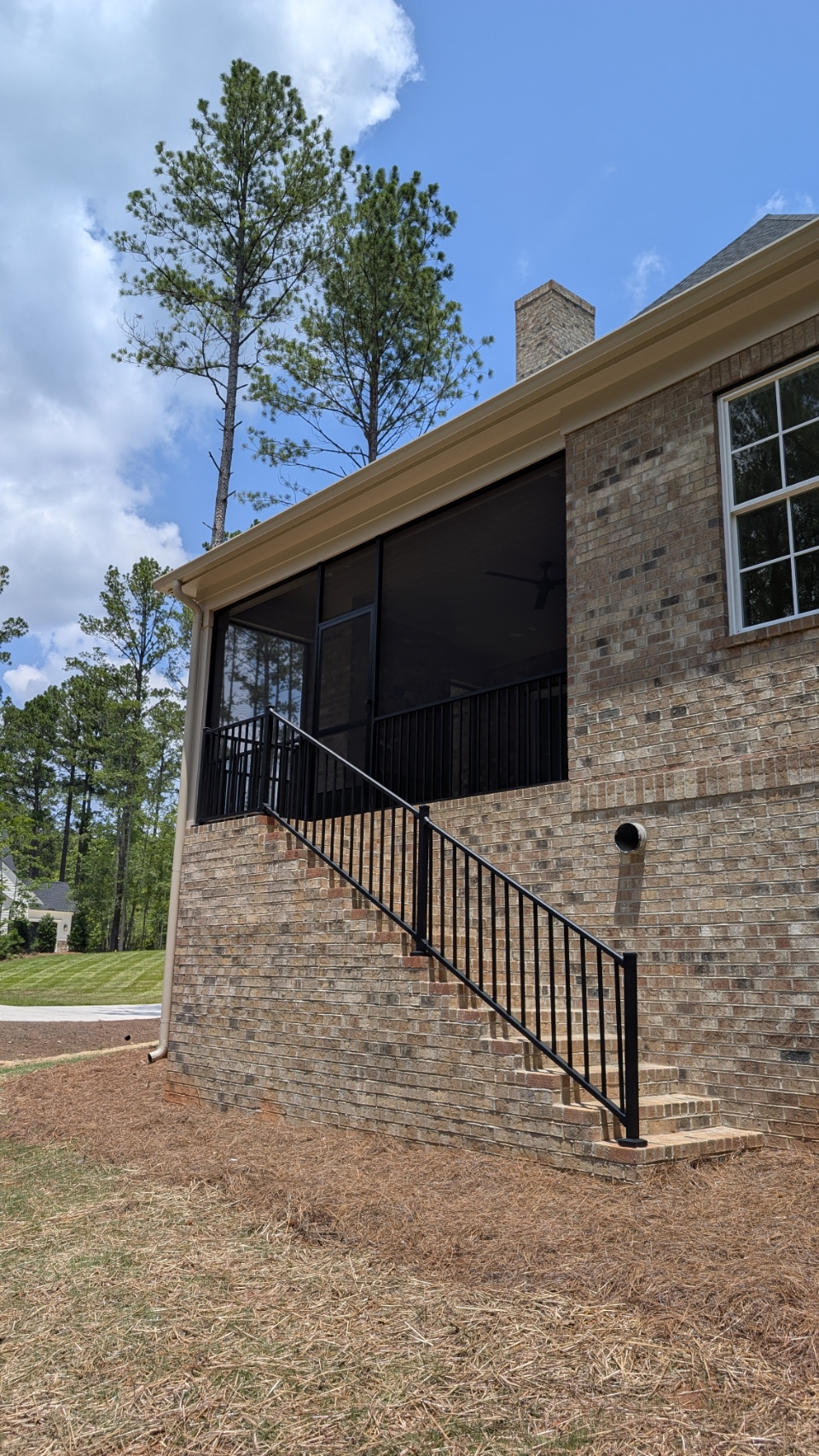 Screened Porch: Elevated brick-home screened porch